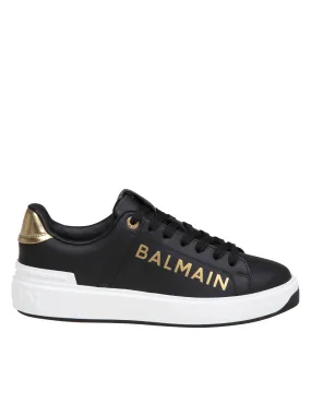 BALMAIN B-COURT SNEAKERS IN BLACK AND GOLD LEATHER