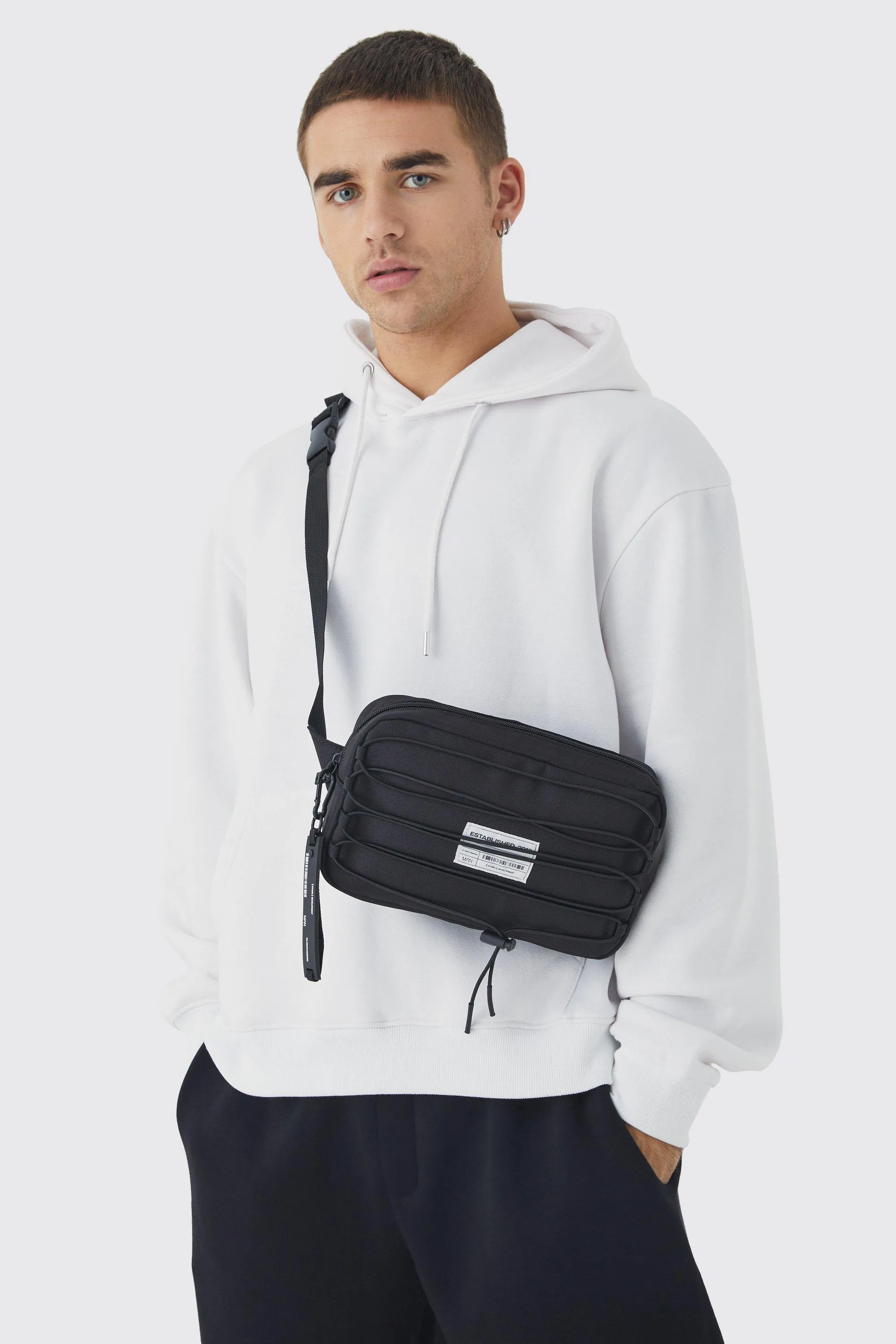 Nylon Bungee Cross Body Bag | boohooMAN UK